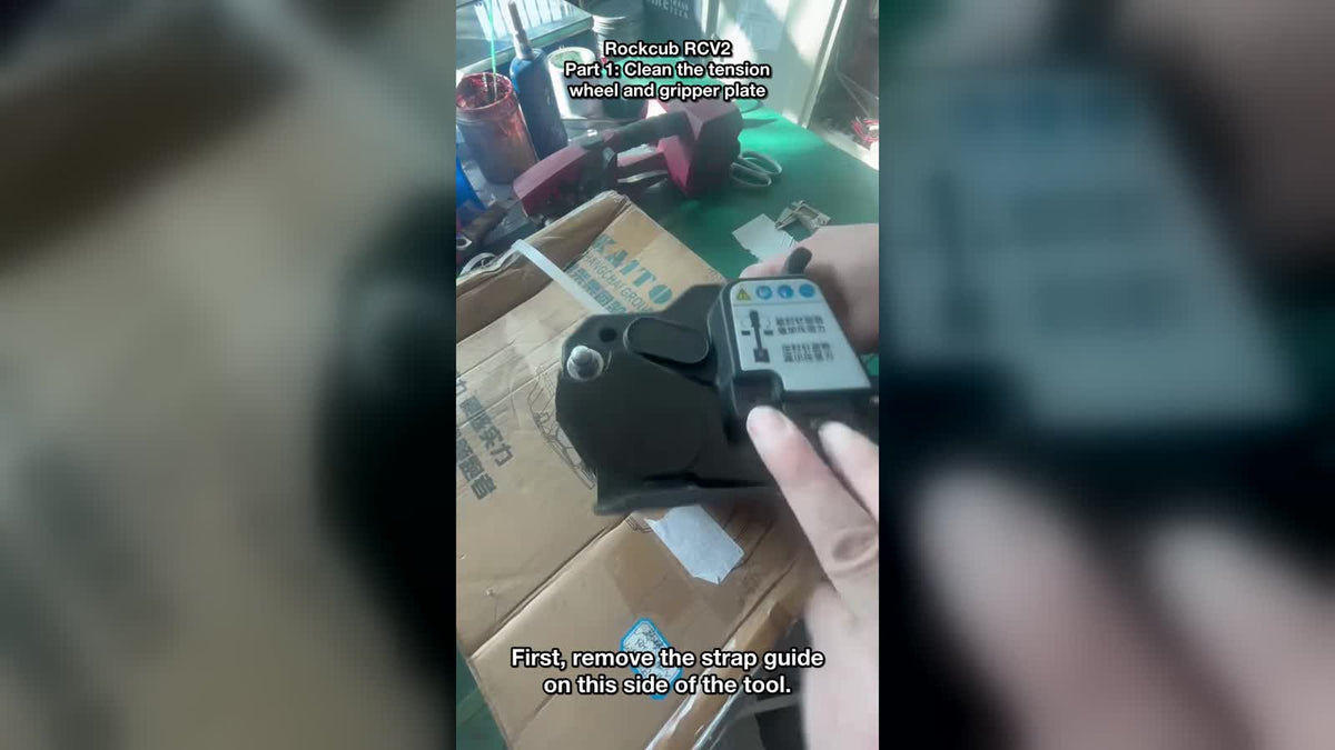 Technician removing the tension wheel from a Rockcub RCV2 strapping tool